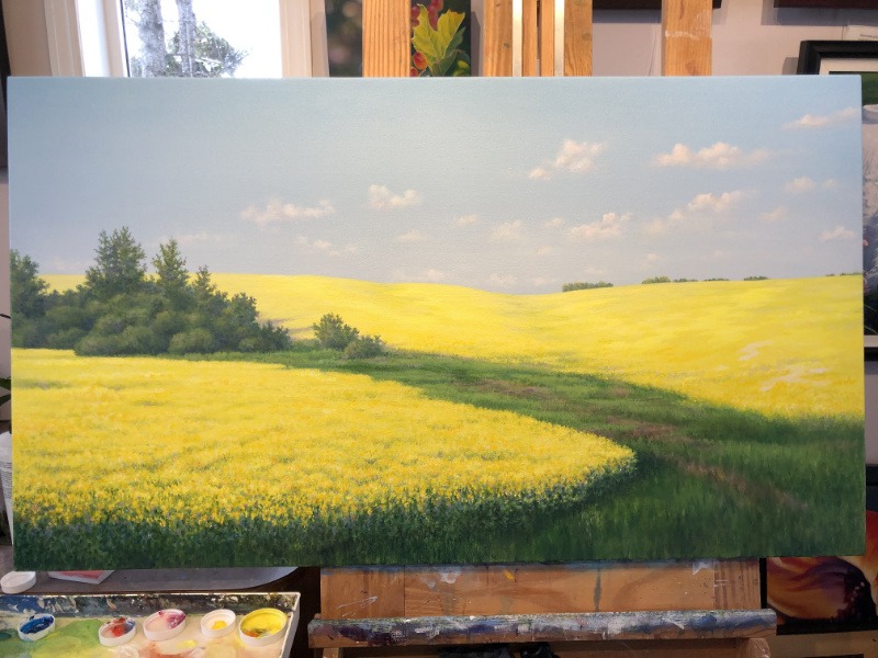 painting of canola field near completion